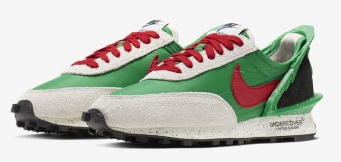 Side view of green, red, and black Nike sneakers.